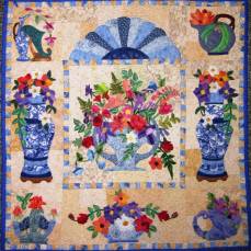 Roseville is a pattern by Maggie Walker. A beautiful floral art quilt with many small appliqués flowers.